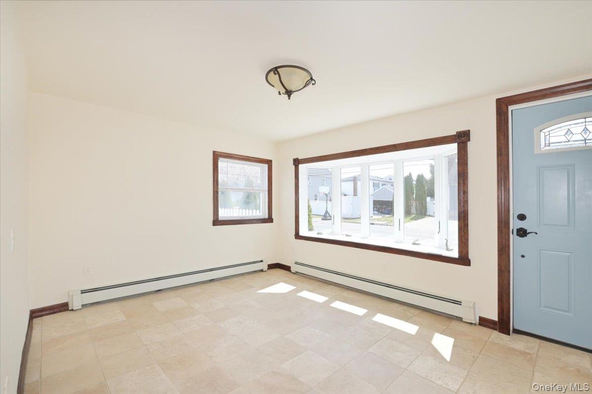 9 Cabot Road West Massapequa, NY 11758 - Photo 14 of 41 a view of an empty room with a window