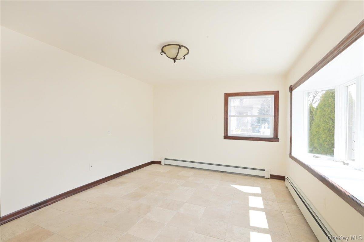 9 Cabot Road West Massapequa, NY 11758 - Photo 15 of 41 an empty room with windows