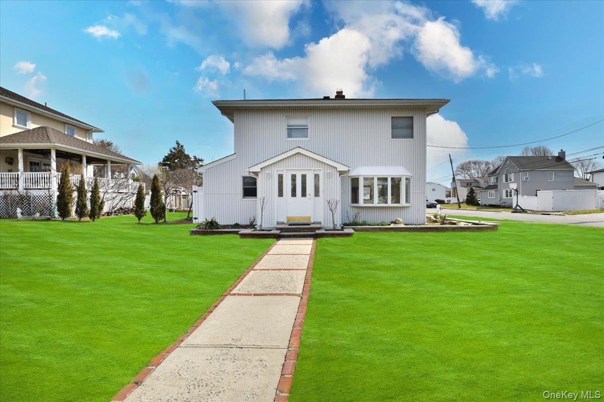 9 Cabot Road West Massapequa, NY 11758 - Photo 2 of 41 a front view of a house with garden