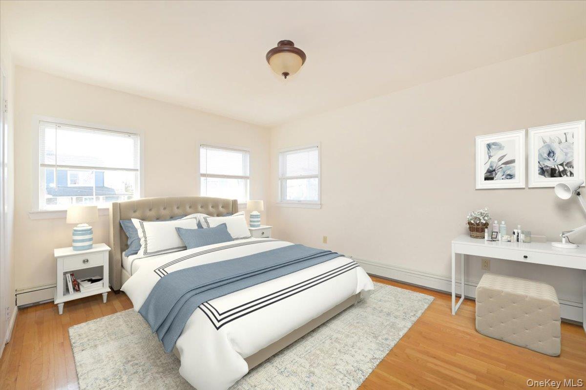 9 Cabot Road West Massapequa, NY 11758 - Photo 22 of 41 a bedroom with a bed and a window