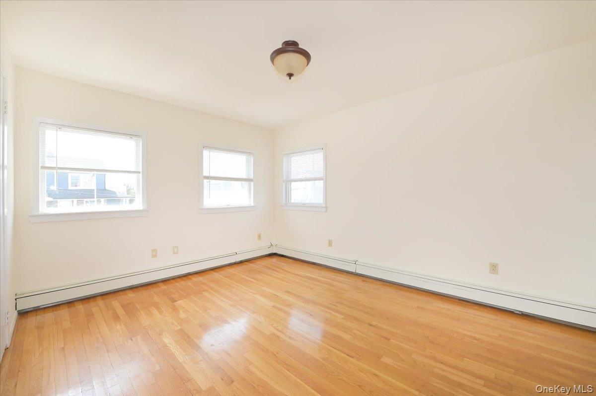9 Cabot Road West Massapequa, NY 11758 - Photo 23 of 41 an empty room with a window