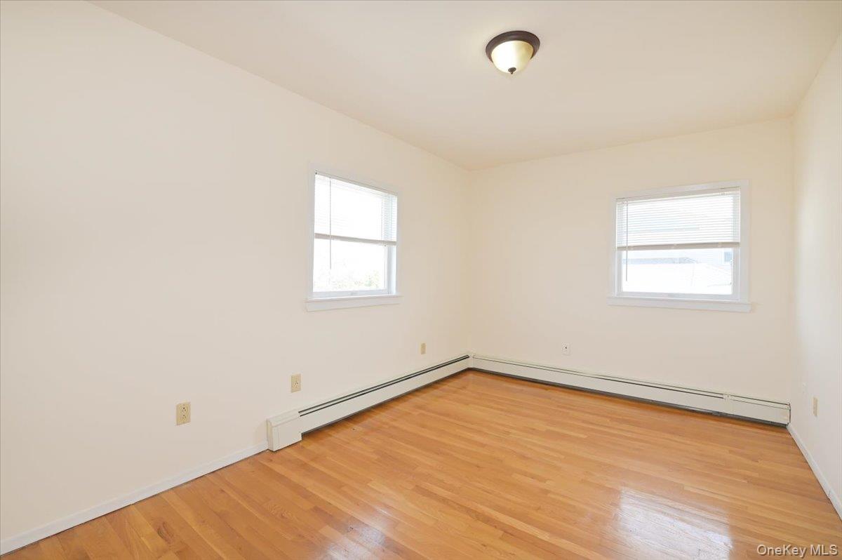 9 Cabot Road West Massapequa, NY 11758 - Photo 27 of 41 an empty room with a window