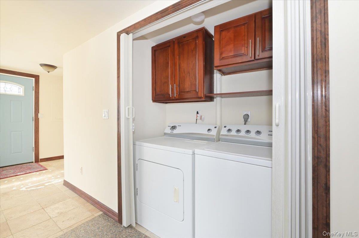 9 Cabot Road West Massapequa, NY 11758 - Photo 29 of 41 a bathroom with a sink and a mirror