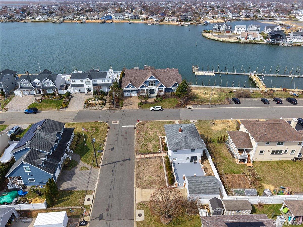 9 Cabot Road West Massapequa, NY 11758 - Photo 35 of 41 an aerial view of a house with outdoor seating