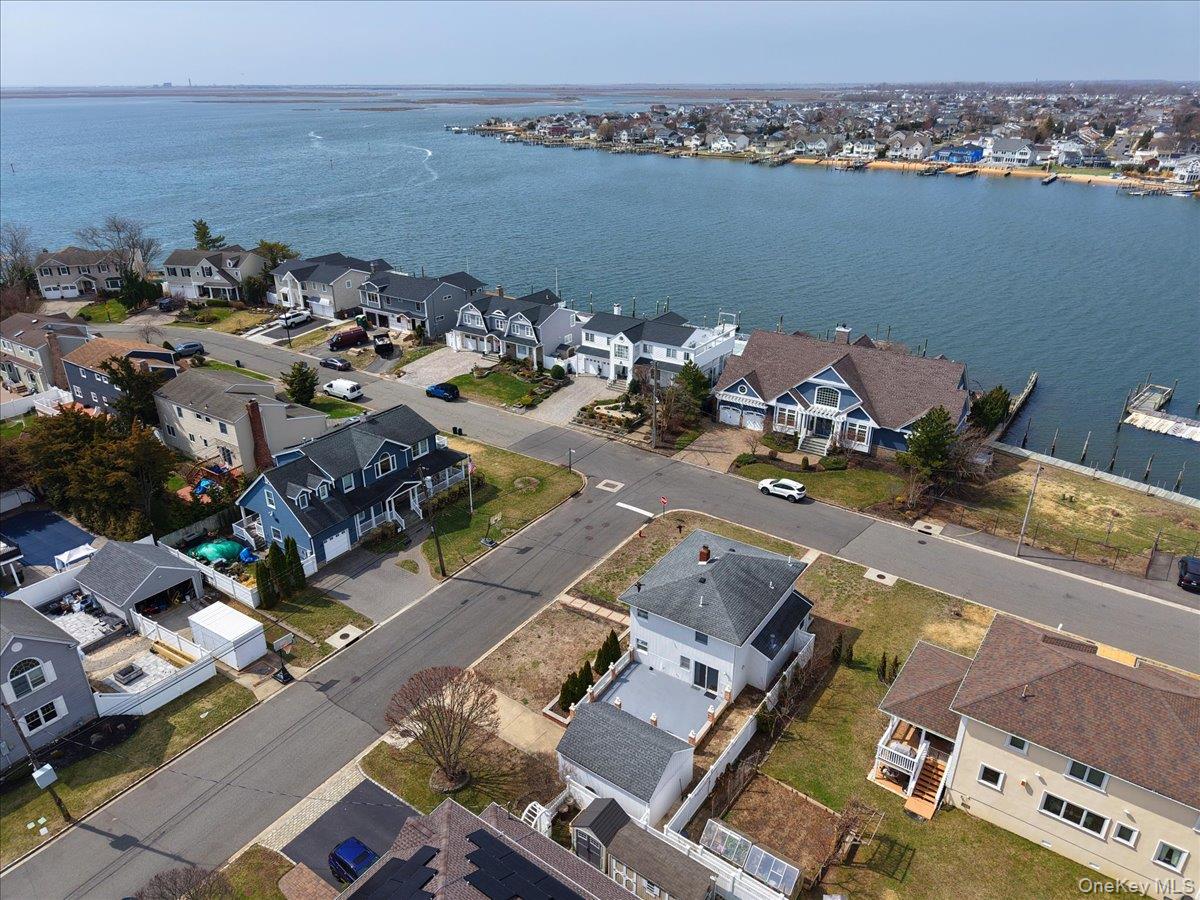 9 Cabot Road West Massapequa, NY 11758 - Photo 37 of 41 an aerial view of a house with a ocean view