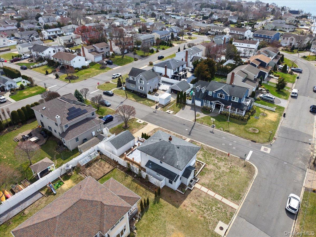 9 Cabot Road West Massapequa, NY 11758 - Photo 40 of 41 an aerial view of a house with a swimming pool