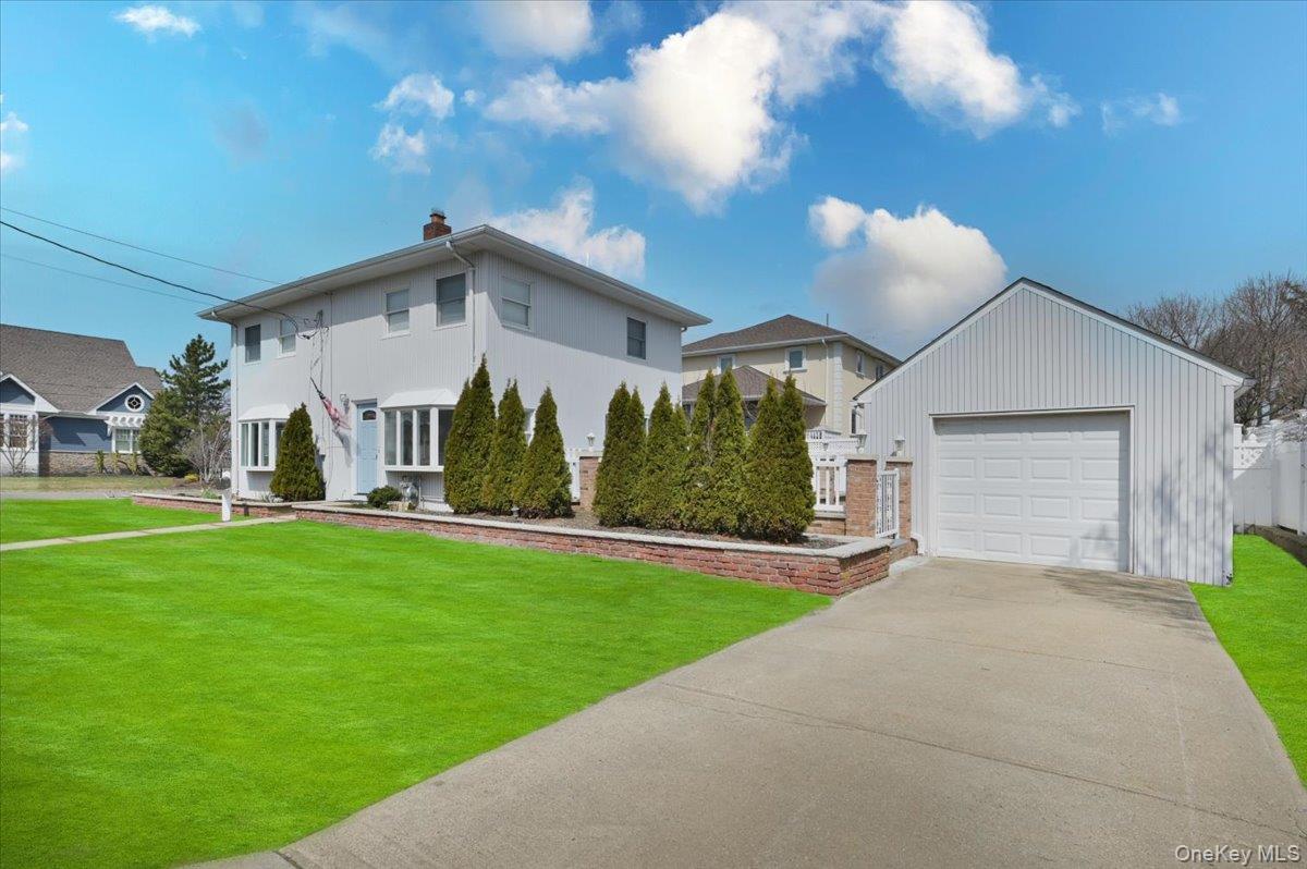 9 Cabot Road West Massapequa, NY 11758 - Photo 4 of 41 a front view of a house with garden