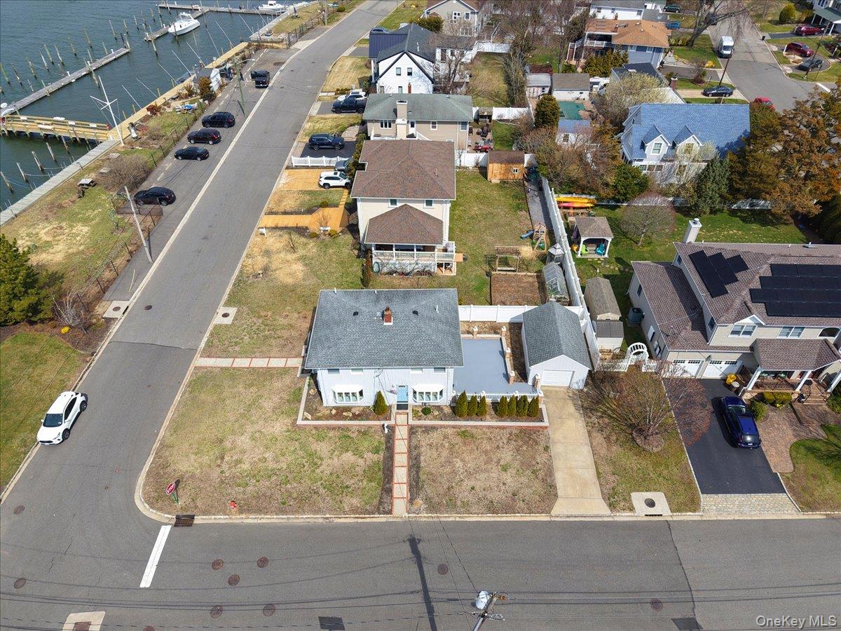 9 Cabot Road West Massapequa, NY 11758 - Photo 5 of 41 an aerial view of residential houses with outdoor space