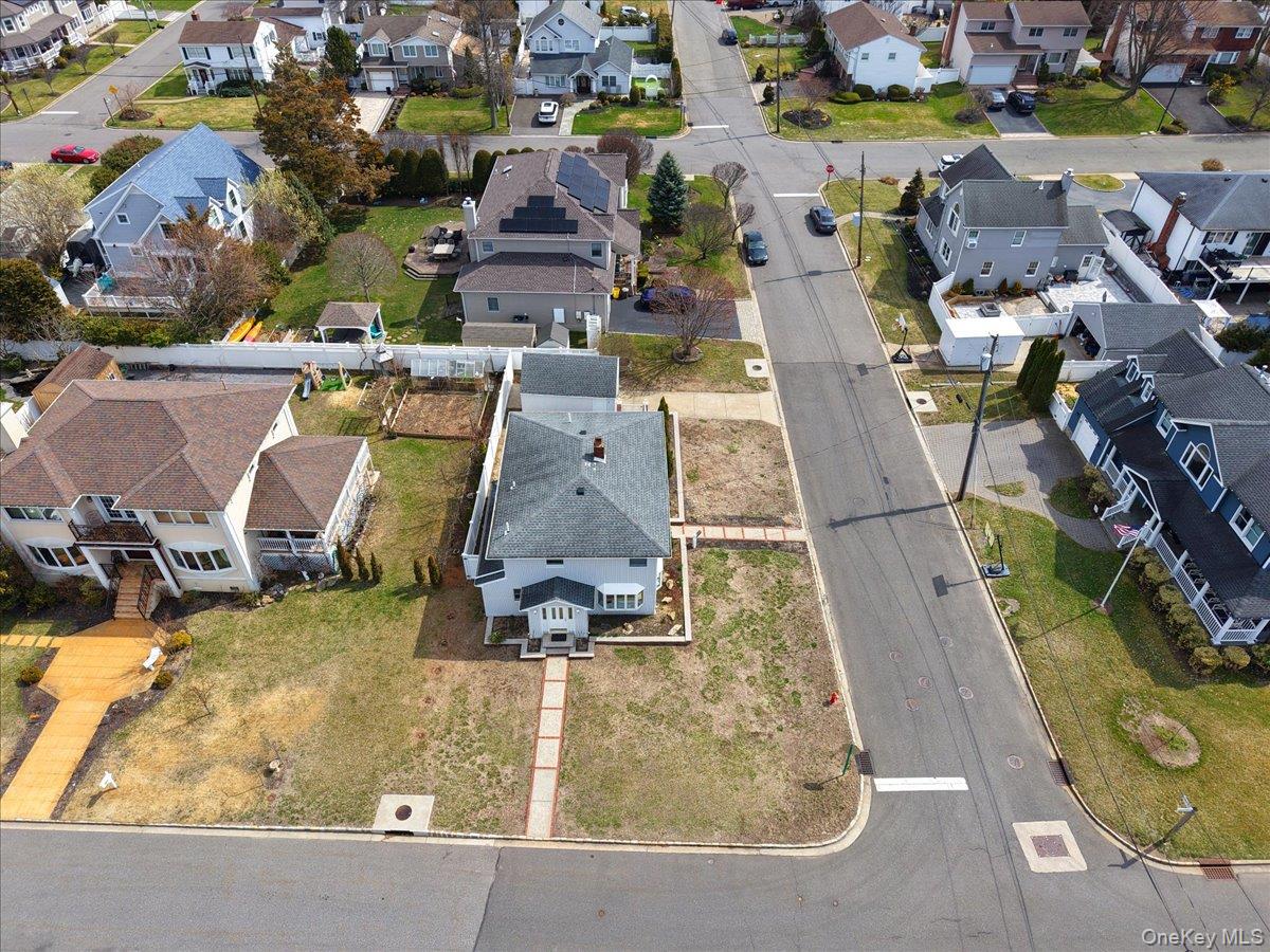 9 Cabot Road West Massapequa, NY 11758 - Photo 6 of 41 an aerial view of a swimming pool