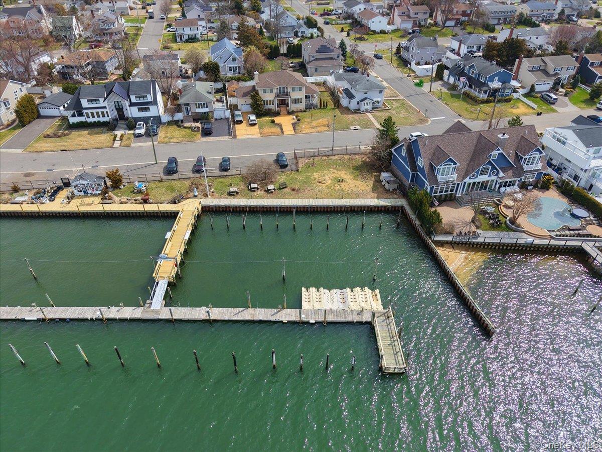 9 Cabot Road West Massapequa, NY 11758 - Photo 7 of 41 an aerial view of a house with a lake view