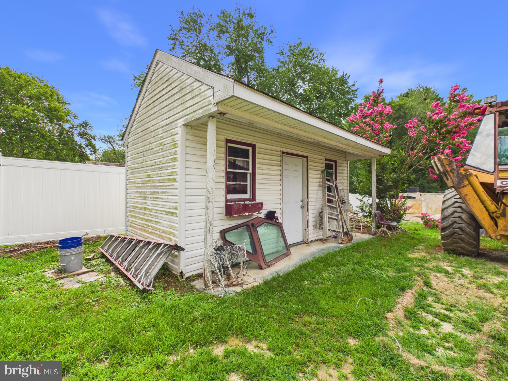 503 Gunby Road Salisbury, MD 21804 - Photo 29 of 36 Charming shed amidst vibrant greenery.