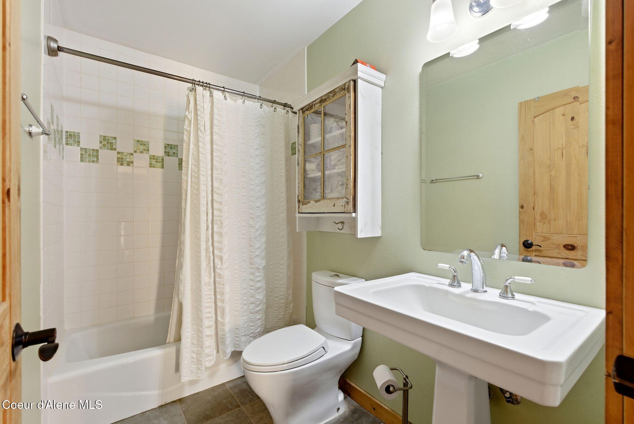 4719 Selle Road Sandpoint, ID 83864 - Photo 39 of 93 Main level guest bathroom