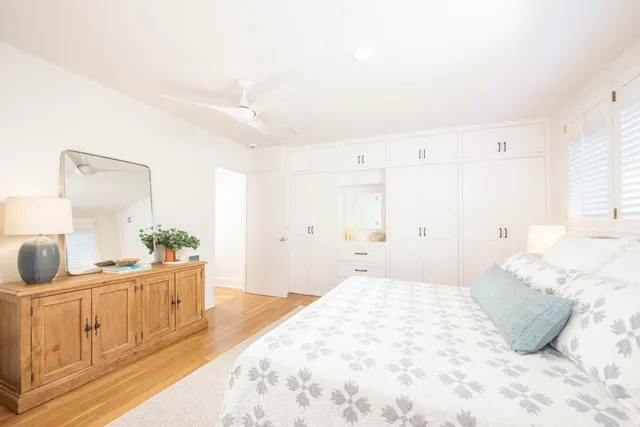 a bedroom with a bed and a cabinets