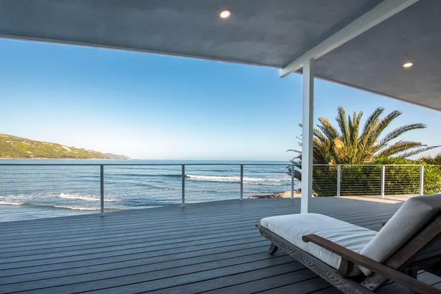 a view of a living room and wooden floor