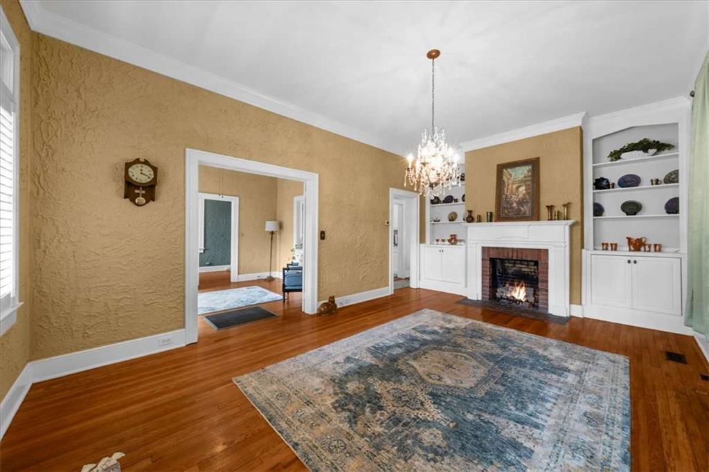 106 Westmore Road Southwest Rome, GA 30165 - Photo 6 of 56 a view of a livingroom with a fireplace and a chandelier