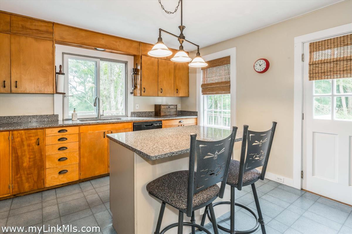 986 State Road Vineyard Haven, MA 02568 - Photo 11 of 27 a view of a dining room with furniture window and outside view