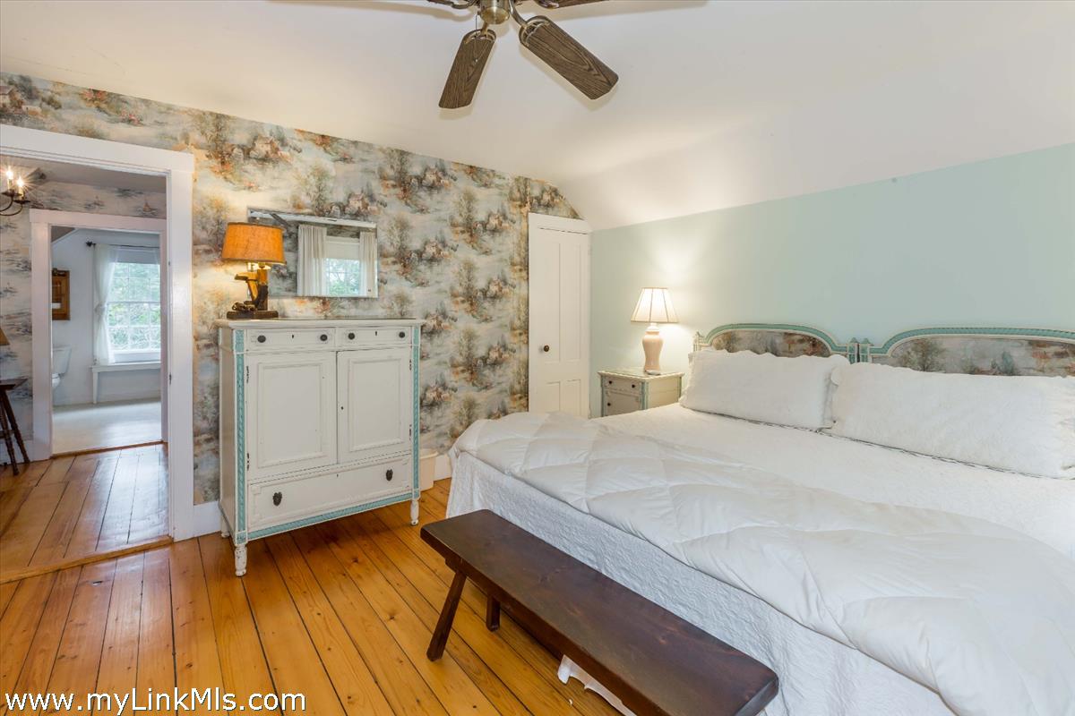 986 State Road Vineyard Haven, MA 02568 - Photo 21 of 27 a bedroom with a bed and a view of bathroom