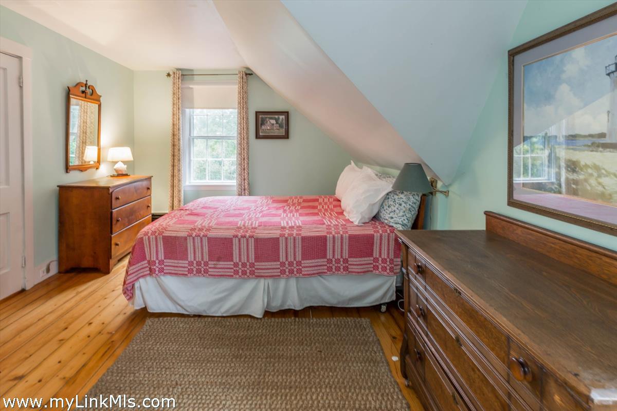 986 State Road Vineyard Haven, MA 02568 - Photo 23 of 27 a bedroom with a bed and window