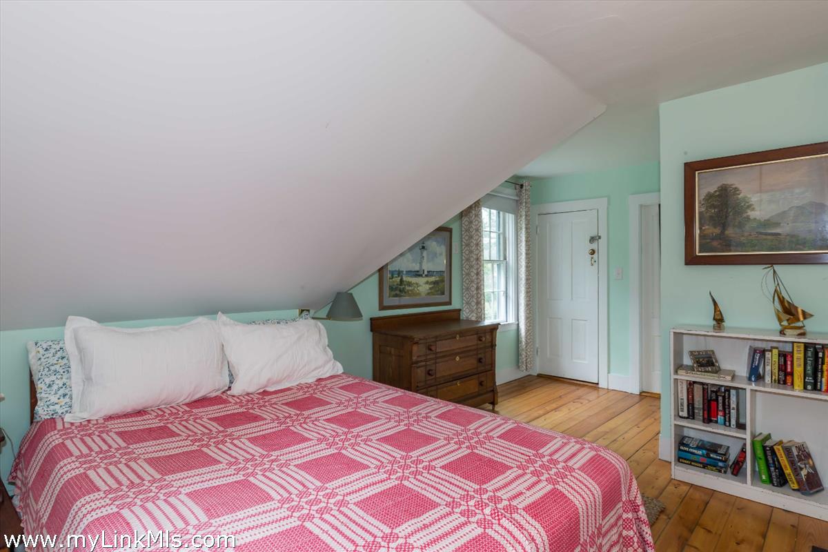 986 State Road Vineyard Haven, MA 02568 - Photo 24 of 27 a bedroom with a bed and dresser in it