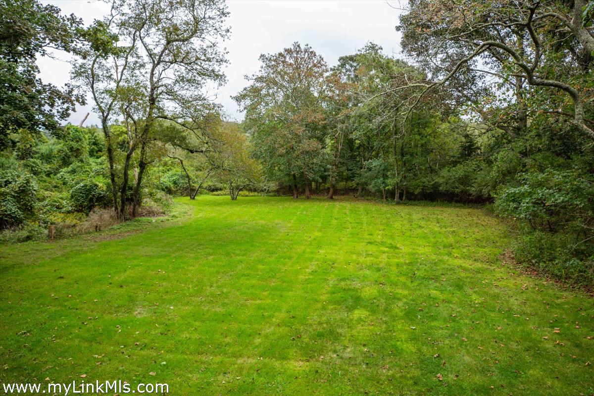 986 State Road Vineyard Haven, MA 02568 - Photo 7 of 27 a view of a green yard
