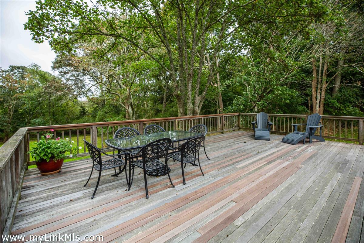 986 State Road Vineyard Haven, MA 02568 - Photo 8 of 27 a view of a deck with wooden floor and outdoor seating