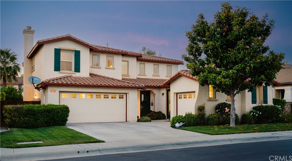 11373 Streamhurst Drive Riverside, CA 92505 - Photo 1 of 1 a front view of a house with a garden and plants