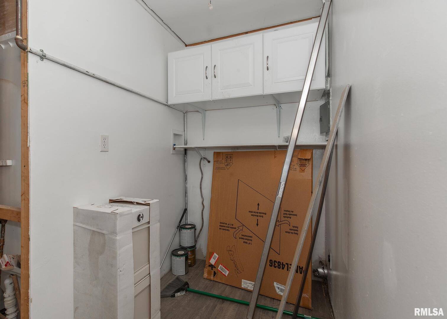 444 6th Street East Milan, IL 61264 - Photo 18 of 26 a view of walk in closet with clothes and shoes