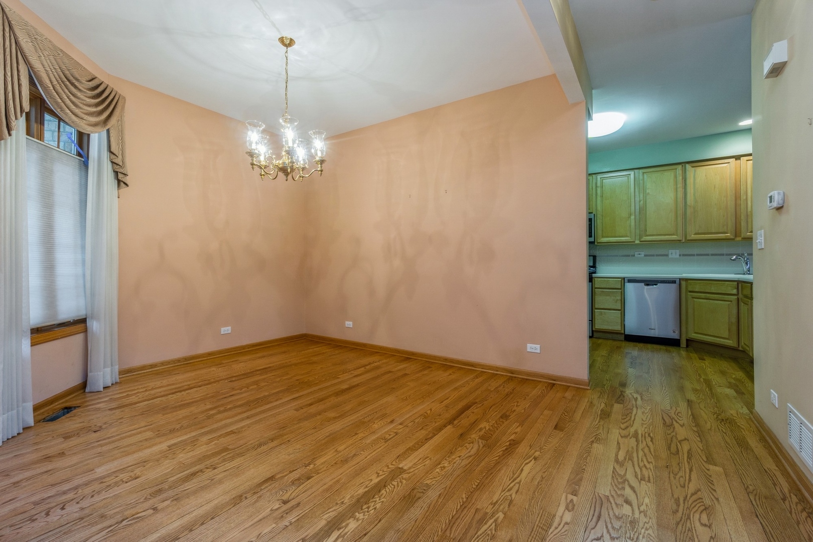 1711 Park Ridge Point Park Ridge, IL 60068 - Photo 3 of 16 a view of an empty room with window and wooden floor