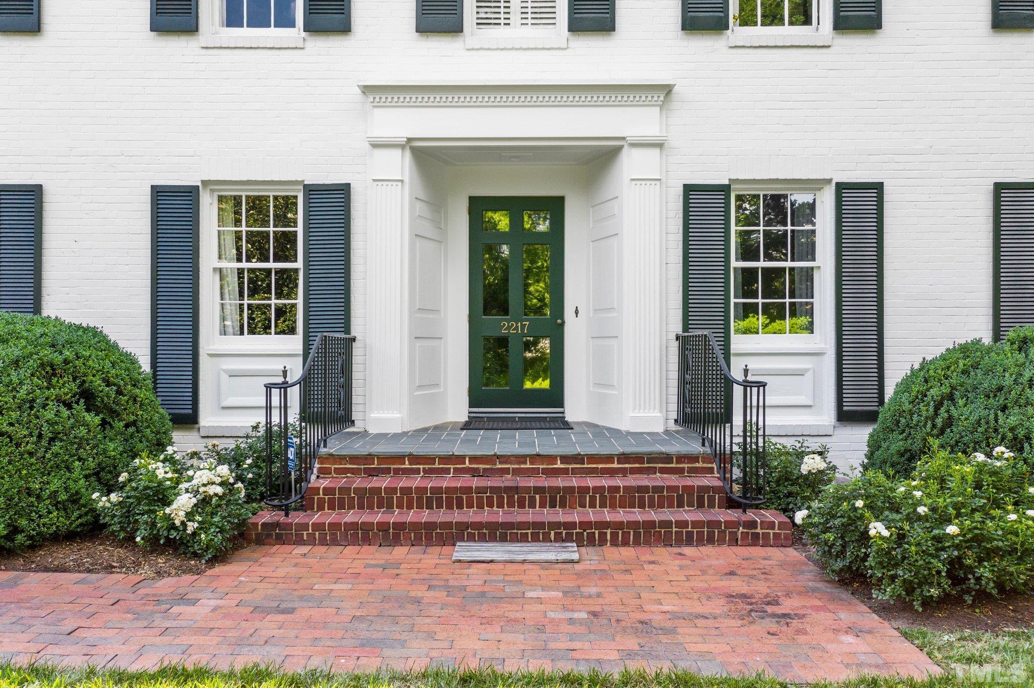 2217 St Marys Street Raleigh, NC 27608 - Photo 4 of 52 a front view of a house with a yard