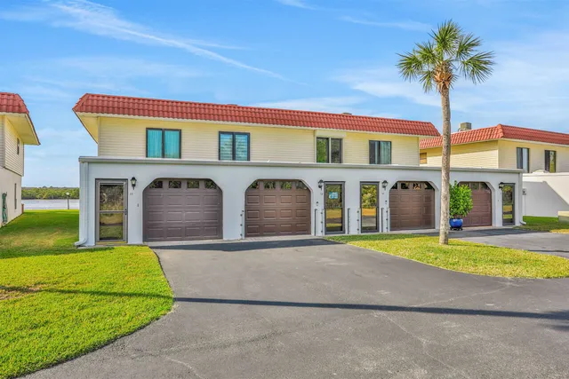 a front view of building with yard