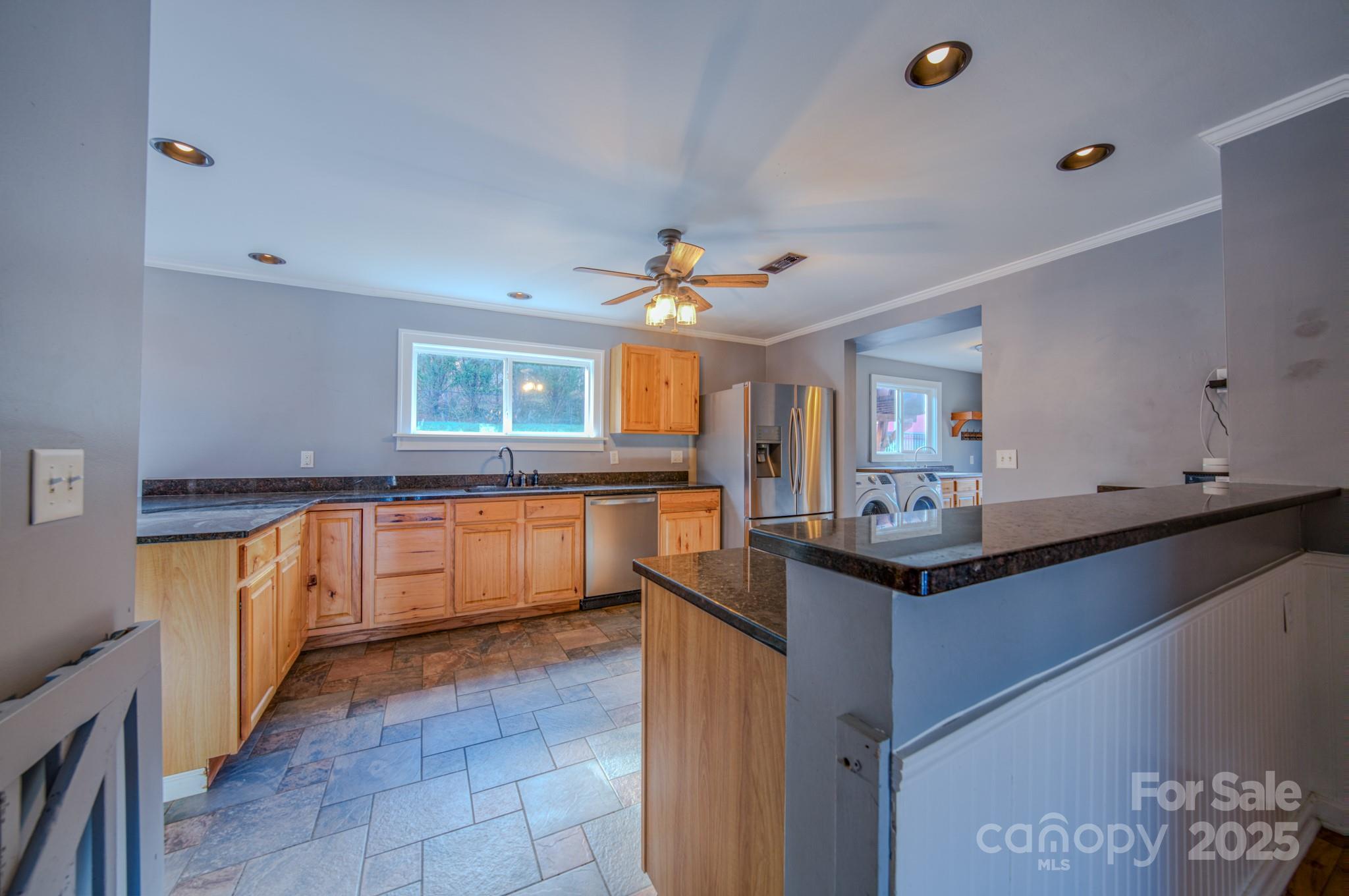 206 Martin Road Swannanoa, NC 28778 - Photo 11 of 42 a kitchen with granite countertop a sink and cabinets