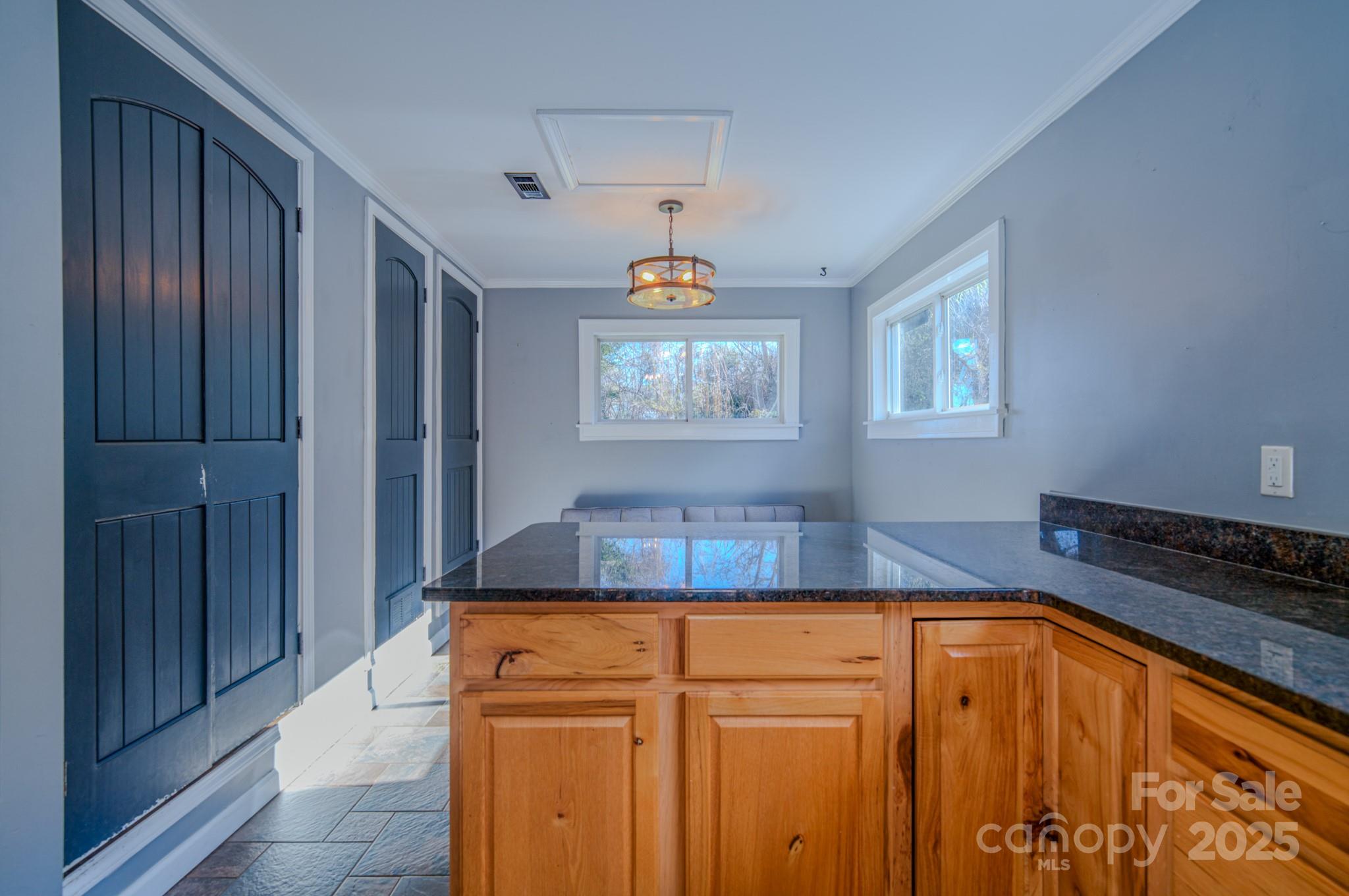 206 Martin Road Swannanoa, NC 28778 - Photo 15 of 42 a kitchen with a sink and a refrigerator