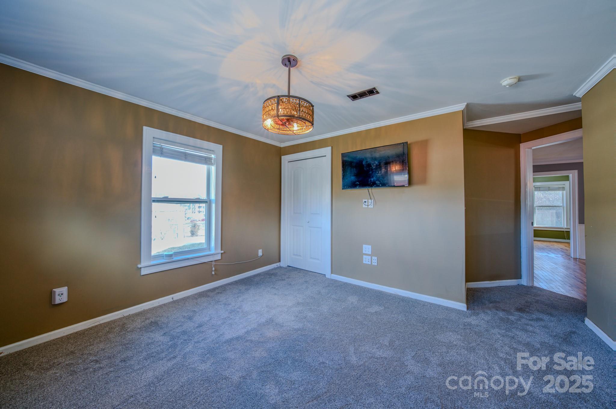 206 Martin Road Swannanoa, NC 28778 - Photo 18 of 42 an empty room with windows and fan