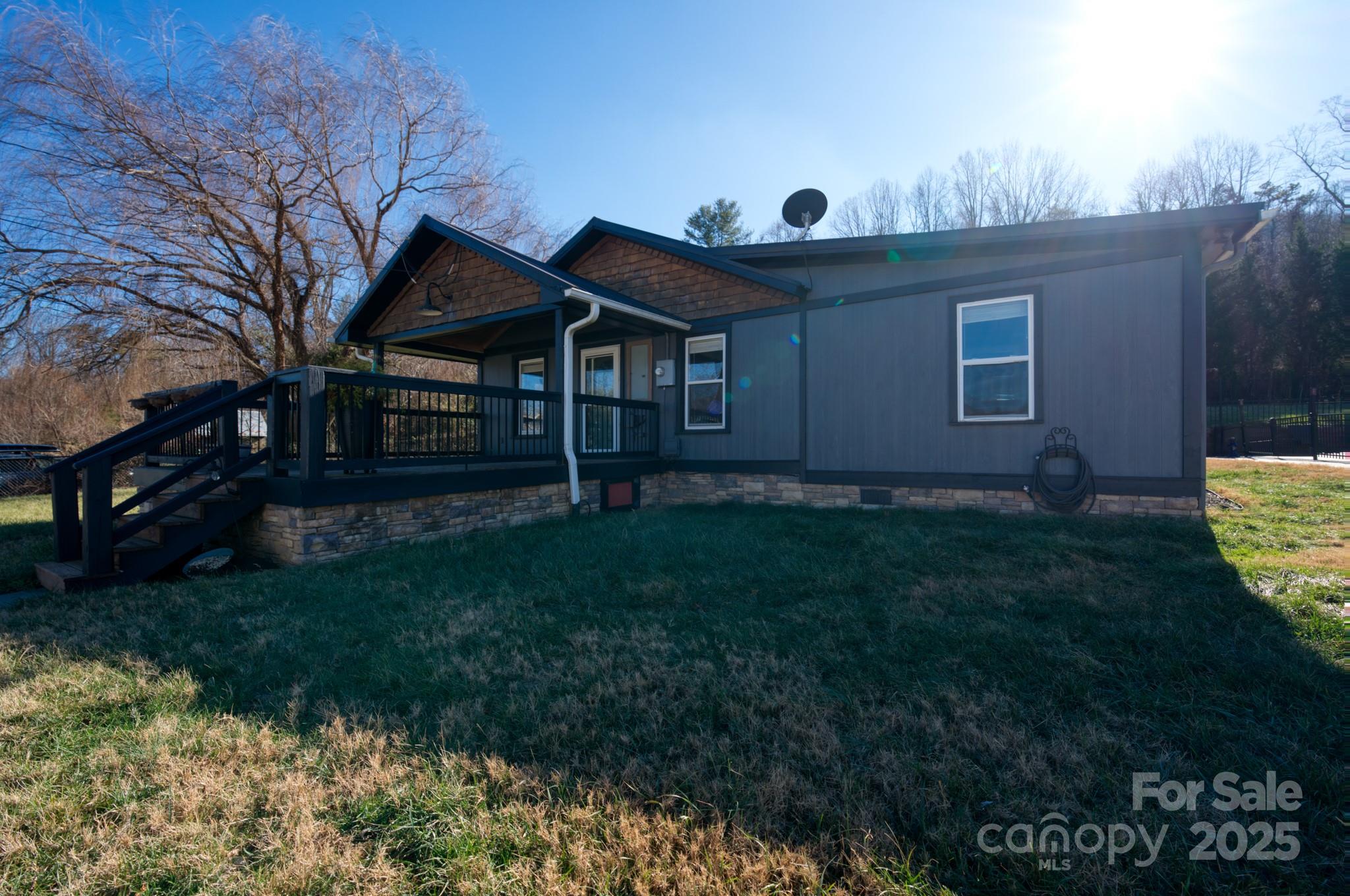 206 Martin Road Swannanoa, NC 28778 - Photo 2 of 42 a front view of a house with garden