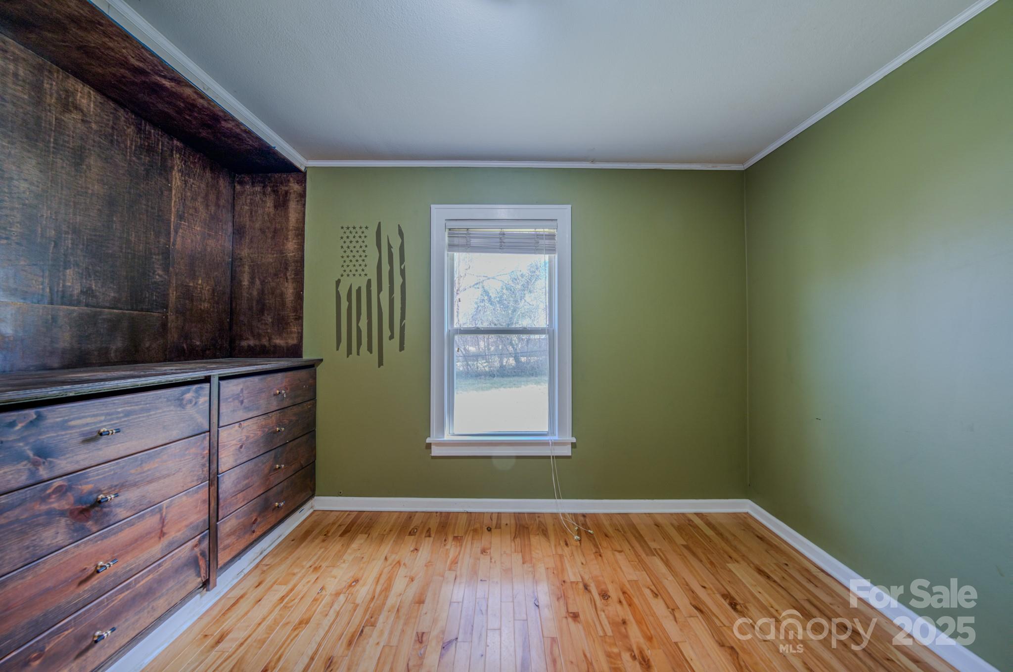 206 Martin Road Swannanoa, NC 28778 - Photo 23 of 42 a view of an empty room with wooden floor and a window