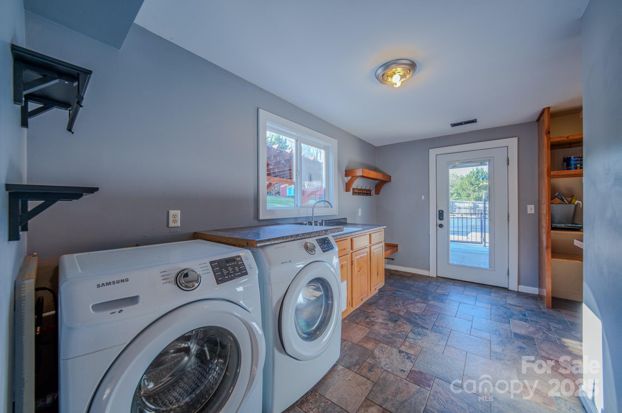 206 Martin Road Swannanoa, NC 28778 - Photo 25 of 42 a utility room with dryer and washer