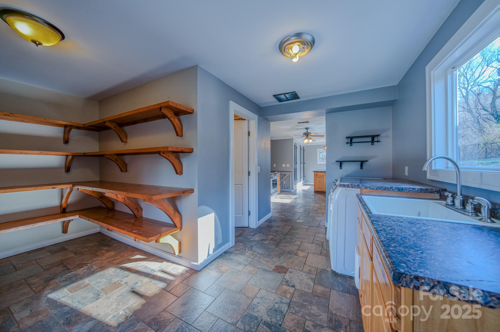 206 Martin Road Swannanoa, NC 28778 - Photo 26 of 42 a view of a kitchen with furniture and a sink