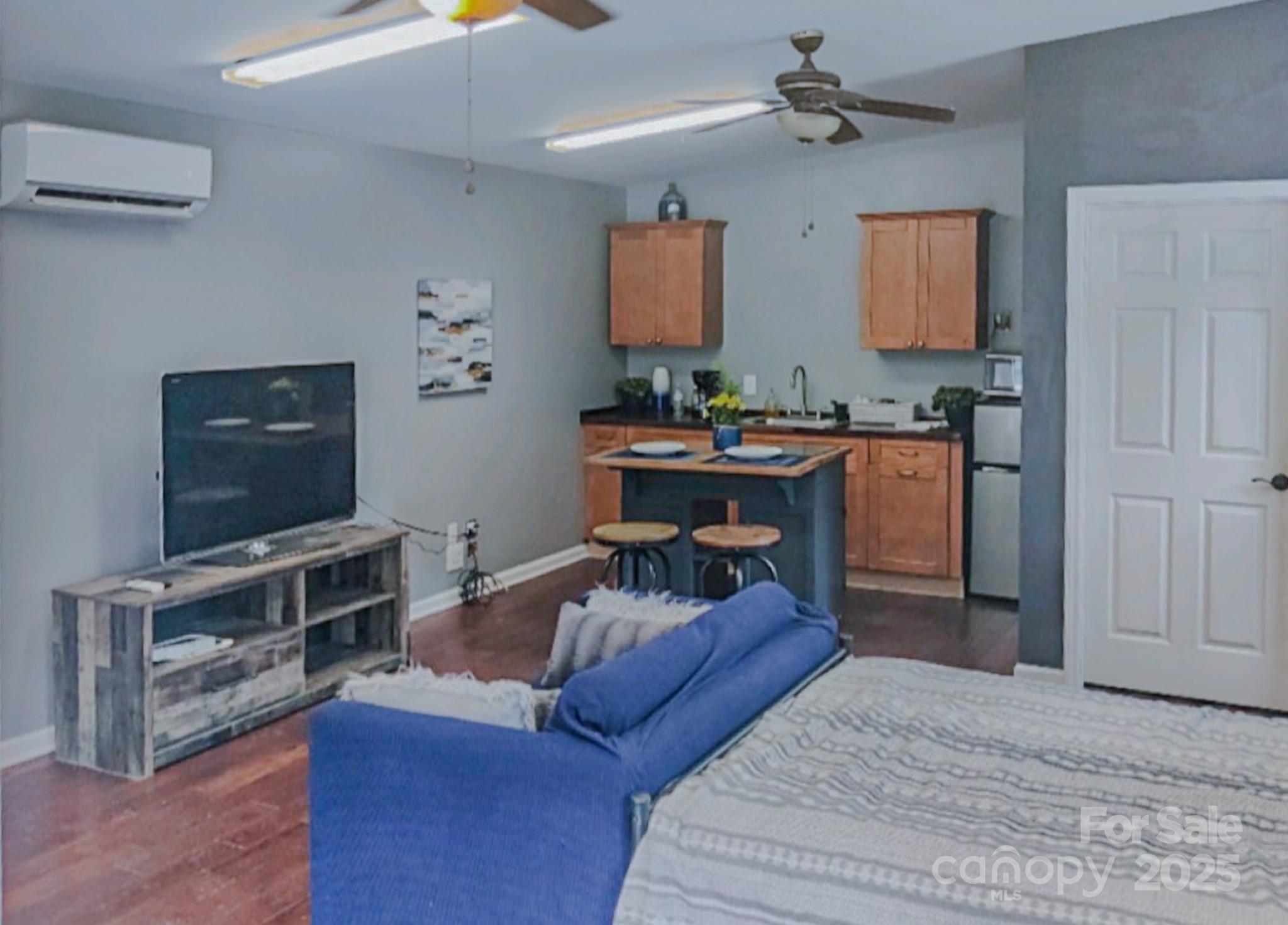 206 Martin Road Swannanoa, NC 28778 - Photo 37 of 42 a living room with furniture and a flat screen tv