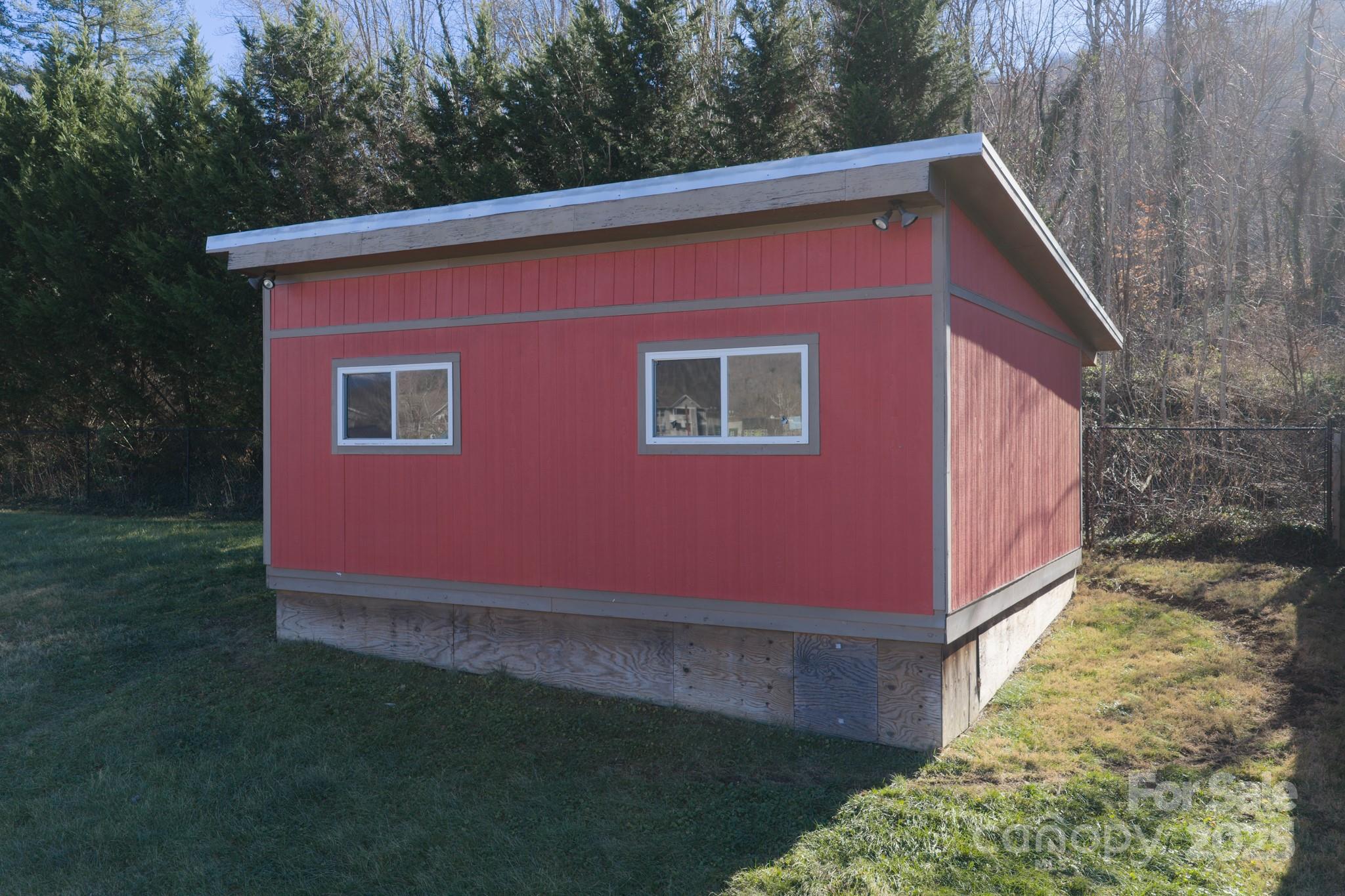 206 Martin Road Swannanoa, NC 28778 - Photo 38 of 42 a red brick house with a yard