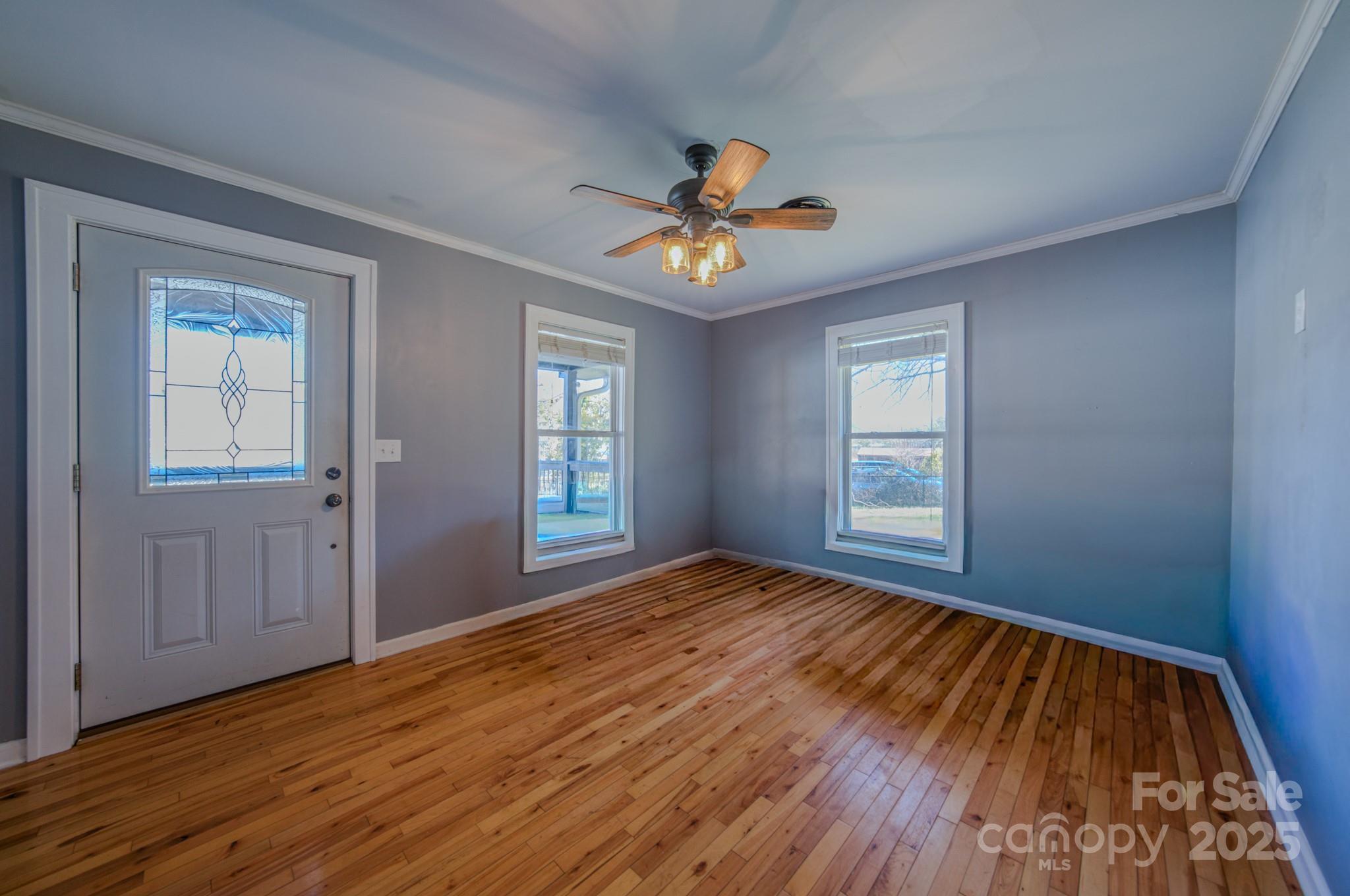 206 Martin Road Swannanoa, NC 28778 - Photo 6 of 42 a view of empty room with wooden floor and fan