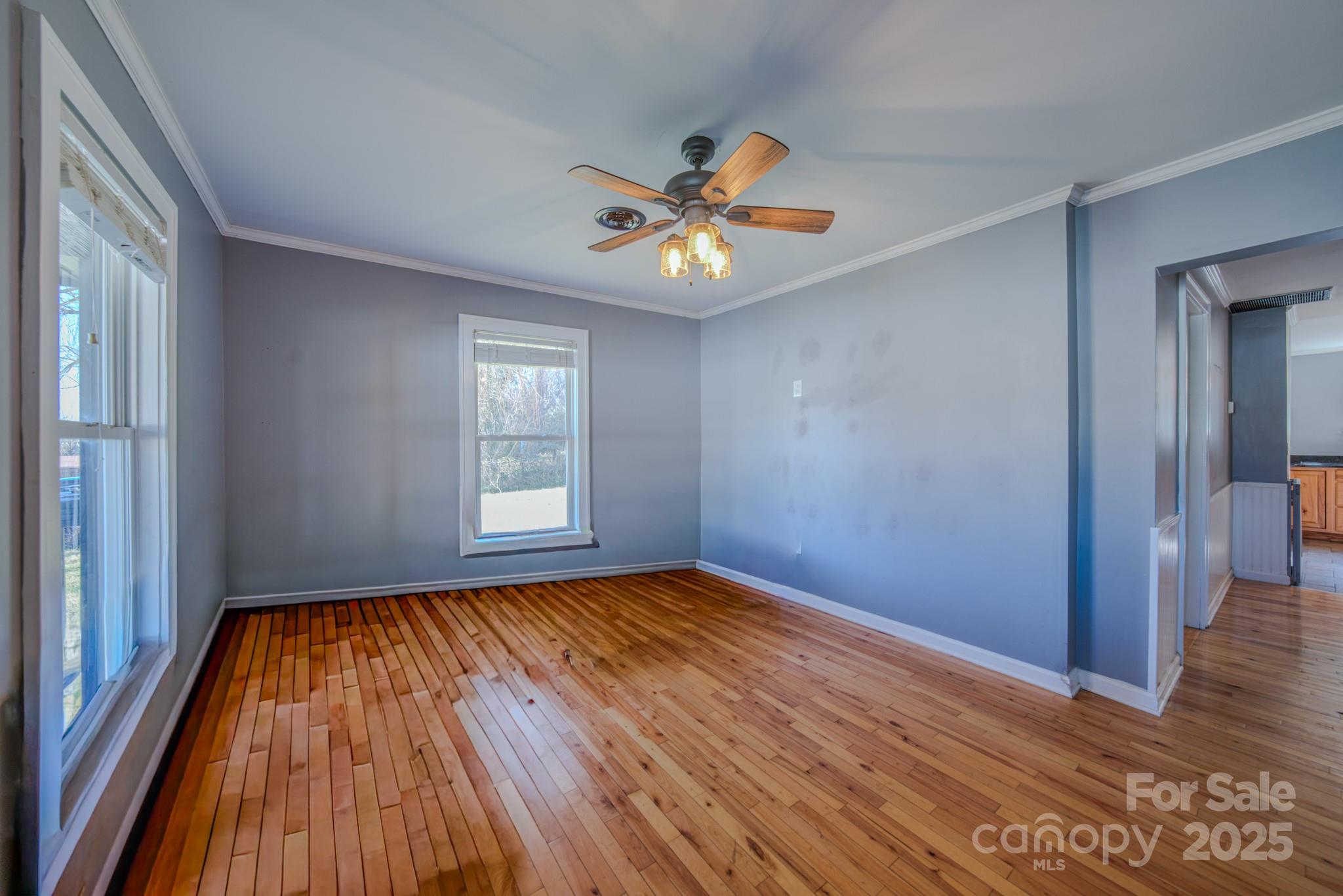 206 Martin Road Swannanoa, NC 28778 - Photo 7 of 42 a view of empty room with wooden floor and fan