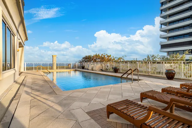 a view of a patio with a table and chairs