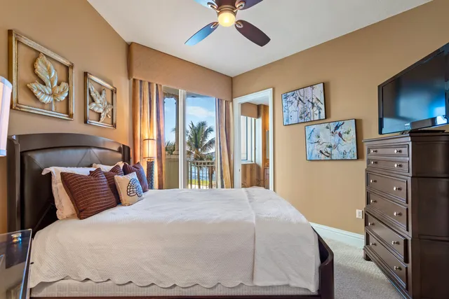 a bedroom with a bed and a large mirror