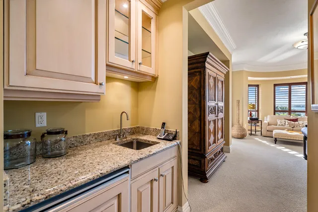 a kitchen with stainless steel appliances granite countertop a sink and cabinets
