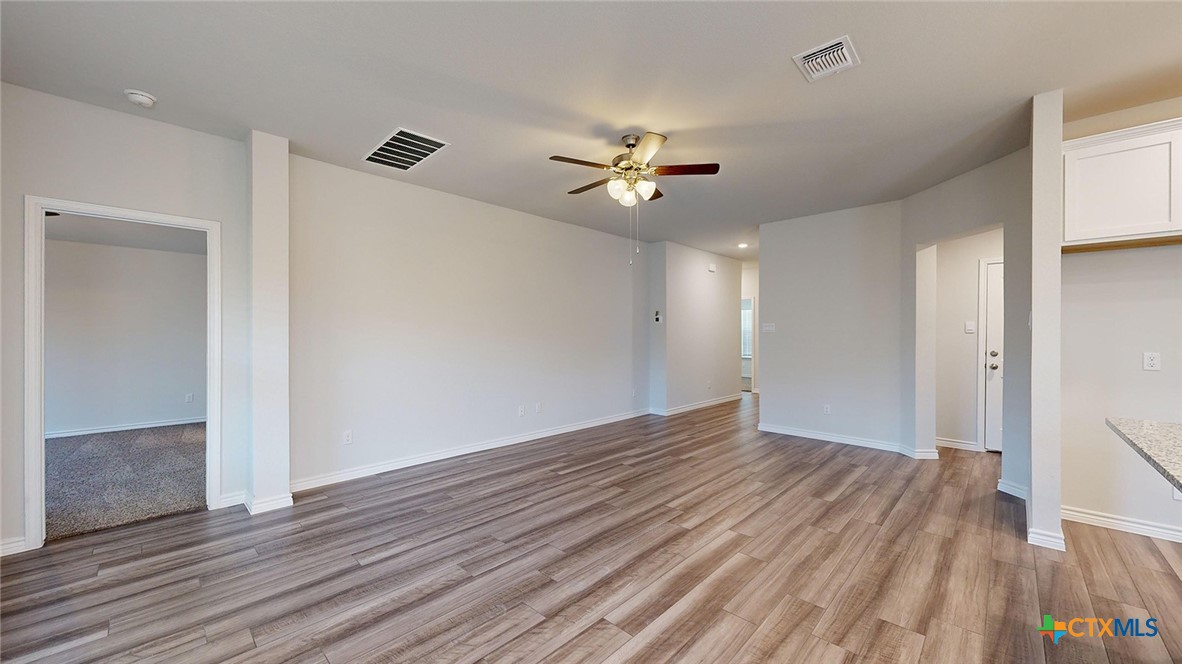 2057 Buckner Street Nolanville, TX 76559 - Photo 12 of 33 a view of empty room with wooden floor