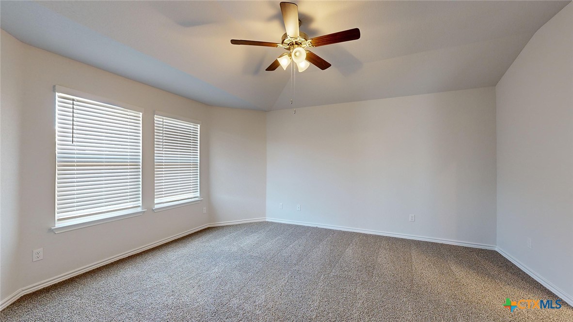 2057 Buckner Street Nolanville, TX 76559 - Photo 17 of 33 an empty room with windows and fan