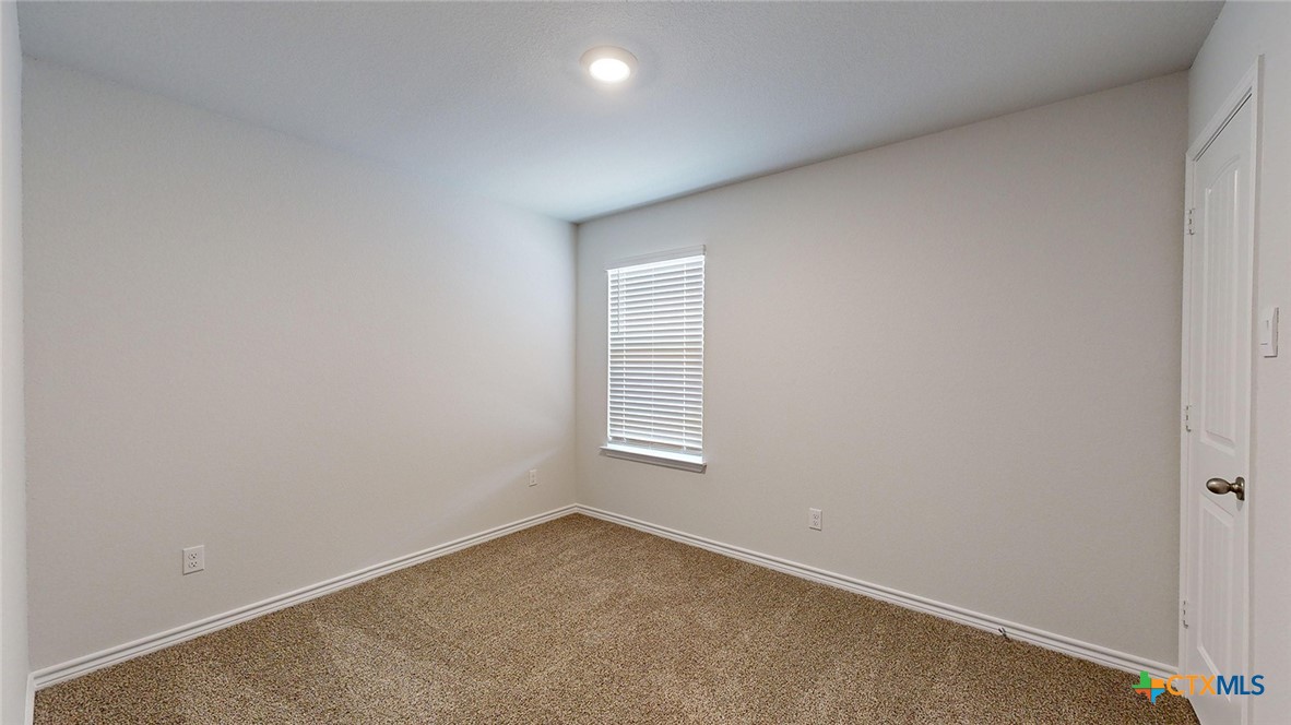 2057 Buckner Street Nolanville, TX 76559 - Photo 28 of 33 an empty room with windows
