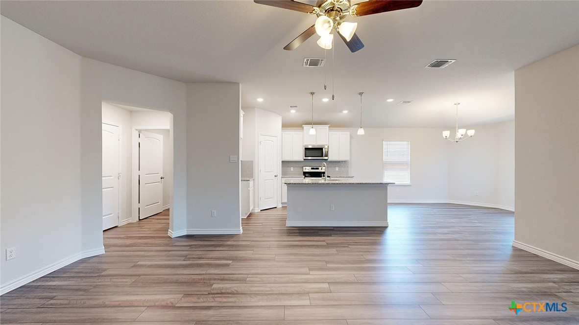2057 Buckner Street Nolanville, TX 76559 - Photo 10 of 33 a view of kitchen and kitchen with wooden floor