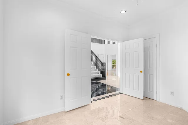 a bathroom with a granite countertop sink and a bathtub