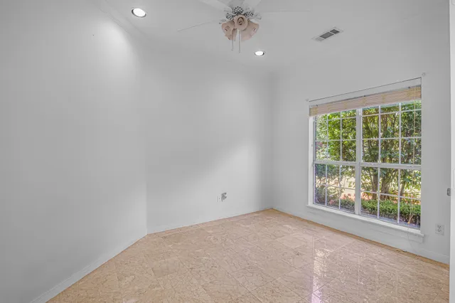 a spacious bathroom with a granite countertop sink mirror and a